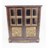 A Chinese carved red and gilt lacquer side cabinet with two pairs of part glazed doors, 107cm wide x