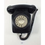 A black vintage wall telephone