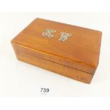 A small boxwood box set to front with silver initials 'K.W'