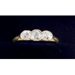 An early 20th century 18 carat gold three stone diamond ring, size L, 1.7g