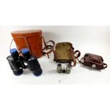 A pair of opera glasses, an old Baldixette camera and a pair of Zenith 7 x 50 binoculars, cased