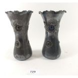 A pair of plated metal Art Nouveau frill topped vases with inset stones and embossed flower and