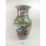 A mid 20th century Chinese vase painted dignitaries and oriental motifs on a scale ground, 37cm tall