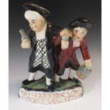 A 19thC Staffordshire pottery figure of drunken watchmen, 21cm