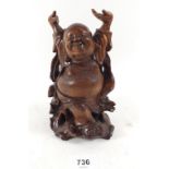 A carved wooden buddha - 18cm