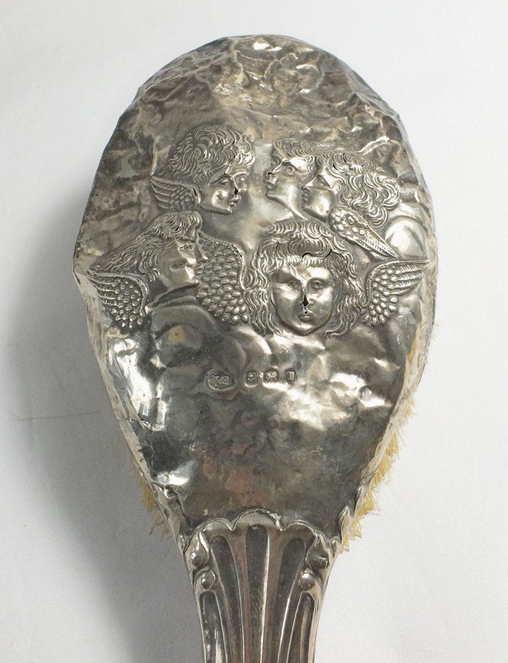 A silver hair brush with embossed angel head decoration and three toiletry/scent bottles with silver - Image 2 of 2