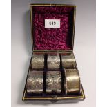 A part set of five Victorian silver plated napkin rings, boxed and a silver one