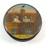 A Victorian circular lacquer snuff box printed and painted saucy roof top lovers scene, entitled '