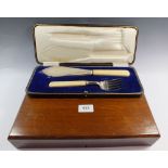 A Victorian silver plated fish cutlery set engraved fish with twelve place settings, cased and a