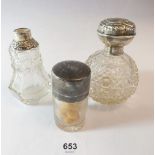 A silver smelling salts jar, Birmingham 1912 and two silver capped scent bottles