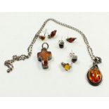 Two silver and amber pendants and three pairs of similar earrings