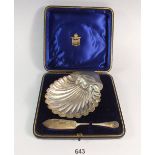 A silver shell form butter dish and knife, boxed, Birmingham 1897, 73g