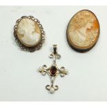 A silver pearl and garnet pendant and two cameo brooches