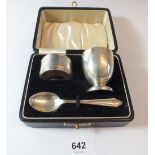 A silver christening set boxed including egg cup, spoon and napkin ring, Birmingham 1935, boxed