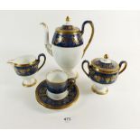 A Wedgwood coffee set comprising: six cups and saucers, coffee pot, sugar and milk with gilt vine on