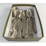 A Victorian silver cutlery set with four place settings: spoons, dessert forks, dinner forks,