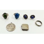 A box of silver jewellery including rings and locket