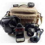 A Canon EOS camera and 30-50mm lens with bag, flash etc.