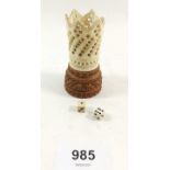 A carved coquilla nut and bone dice shaker and dice - a/f