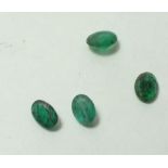 A group of 2.25 carats of oval cut emeralds