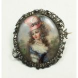 An 18th century French miniature painted enamel brooch, the central oval panel depicting a young
