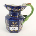 A Victorian floral painted blue octagonal jug, 14cm