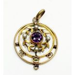 An Edwardian pendant set amethyst and seed pearls, 2.2cm diameter