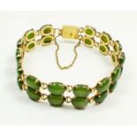A 14 carat gold double link bracelet set jade