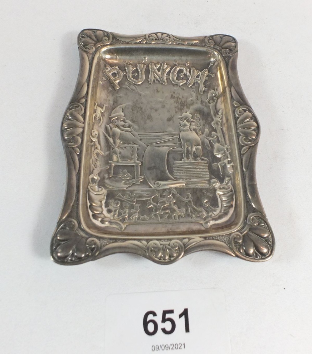 A Punch silver pin tray embossed Mr Punch and his dog, 10 x 7cm, 31g, Birmingham 1876 maker JW