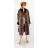 A ladies ocelot fur coat with sheepskin cuffs and fur collar