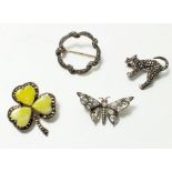 Three vintage silver brooches and one continental silver brooch to include a cat, paste butterfly,