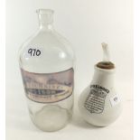 A Nelsons Improved inhaler and a large glass poison bottle