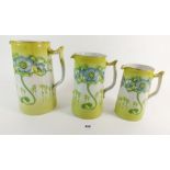 A set of three Edwardian Art Nouveau graduated jugs