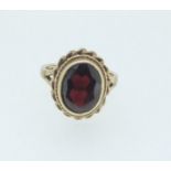 A 9 carat gold garnet ring, 3.4g, size I