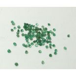 A group of 5 carats of 1mm round cut emeralds