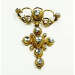 An 18th century Iberian gilt metal pendant set with facet cut paste, 5cm