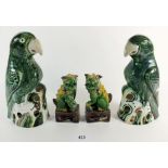 A pair of Gladstone pottery Chinese style parrots 21cm tall and a pair of Kylin lions
