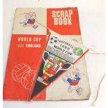 A 1966 Football World Cup scrap book and pennant plus two 'England Winners' stamps