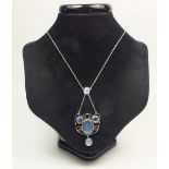 An Edwardian Arts & Crafts moonstone pendant necklace on a fine white metal link chain