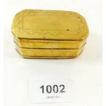 An early 19th century brass snuff box with engraved decoration