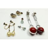 Two pairs of modern silver earrings, a pair of aquamarine earrings and a pair of faux pearl earrings