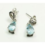 A pair of 9 carat white gold drop earrings set blue topaz, stamped 375, 2.1g