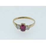A 9 carat gold ring set ruby and white stones, size W/Z
