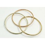 A 9 carat gold three colour triple bangle, 11g