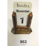 A Japanese lacquered metal desk calendar with turkey decoration - calendar cards incomplete