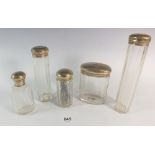 A set of Edwardian hallmarked silver topped glass dressing table jars, makers makers CJF