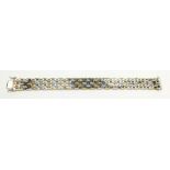 A 14 carat coloured white and yellow gold bracelet, 33g, 19cm