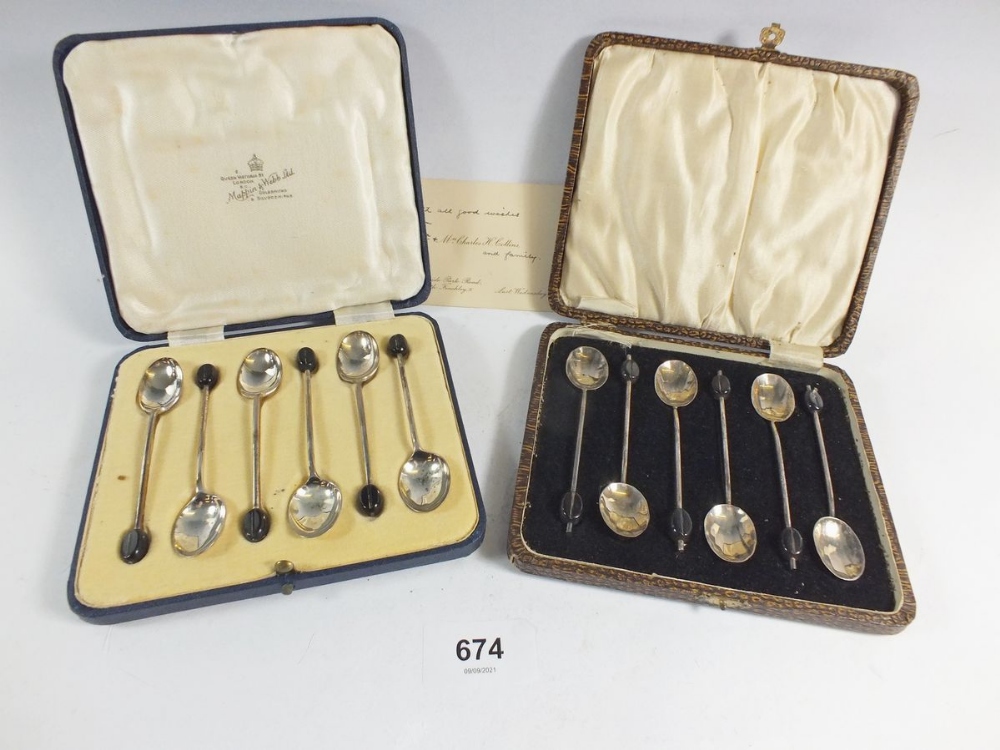 Two sets of silver coffee spoons with bean terminals, cased, Mappin & Webb 1933 and Birmingham 1929