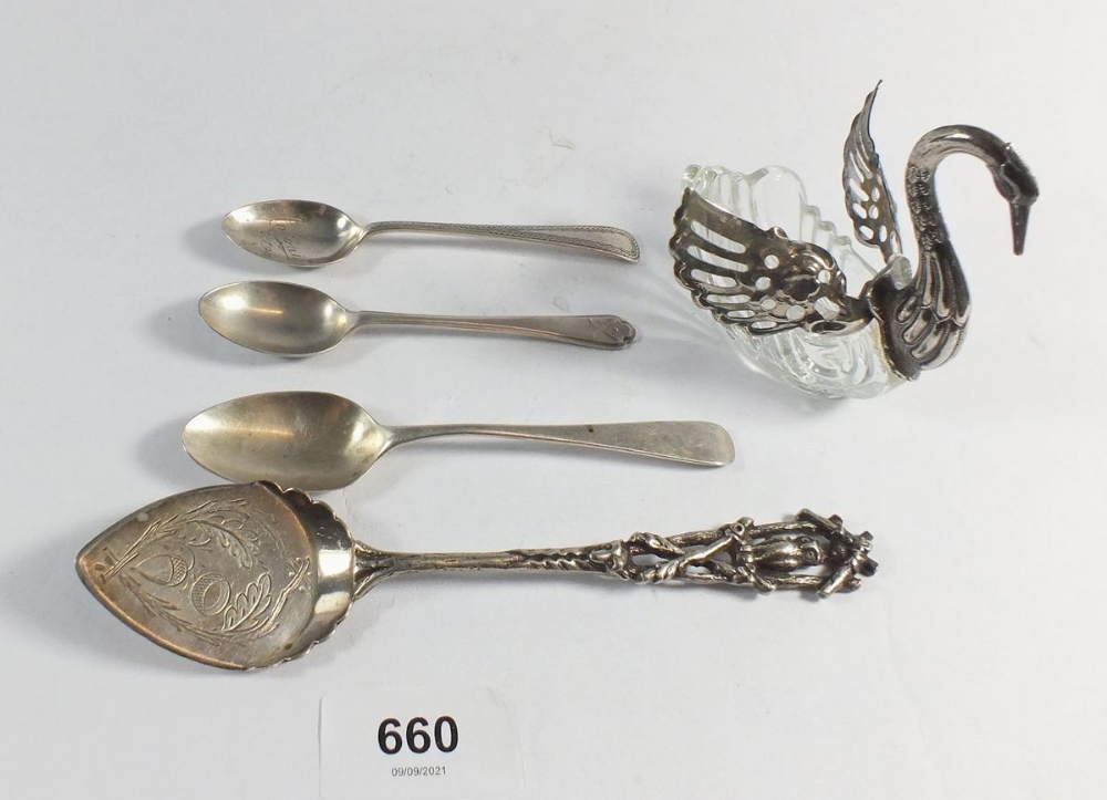 Three silver teaspoons, a silver plated preserve spoon and a white metal and glass swan