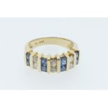 A 14 carat gold sapphire and diamond ring, size L-M